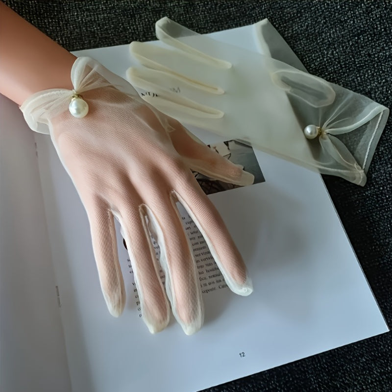 Wedding gloves made of fine tulle decorated with pearl