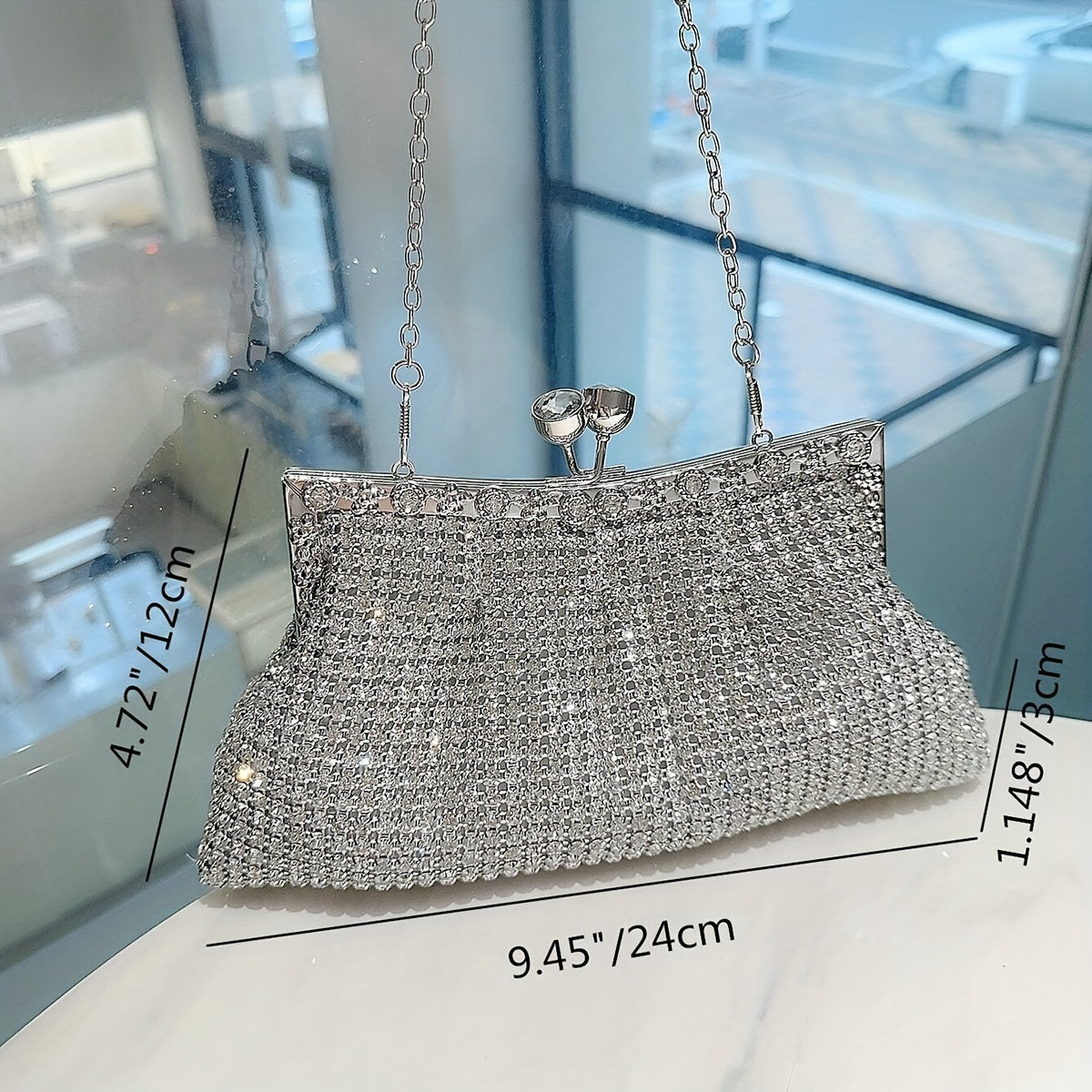 Glittery evening clutch decorated with rhinestones