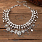 Necklace with pendants in the shape of a rose, pentagram, oval, heart and cross
