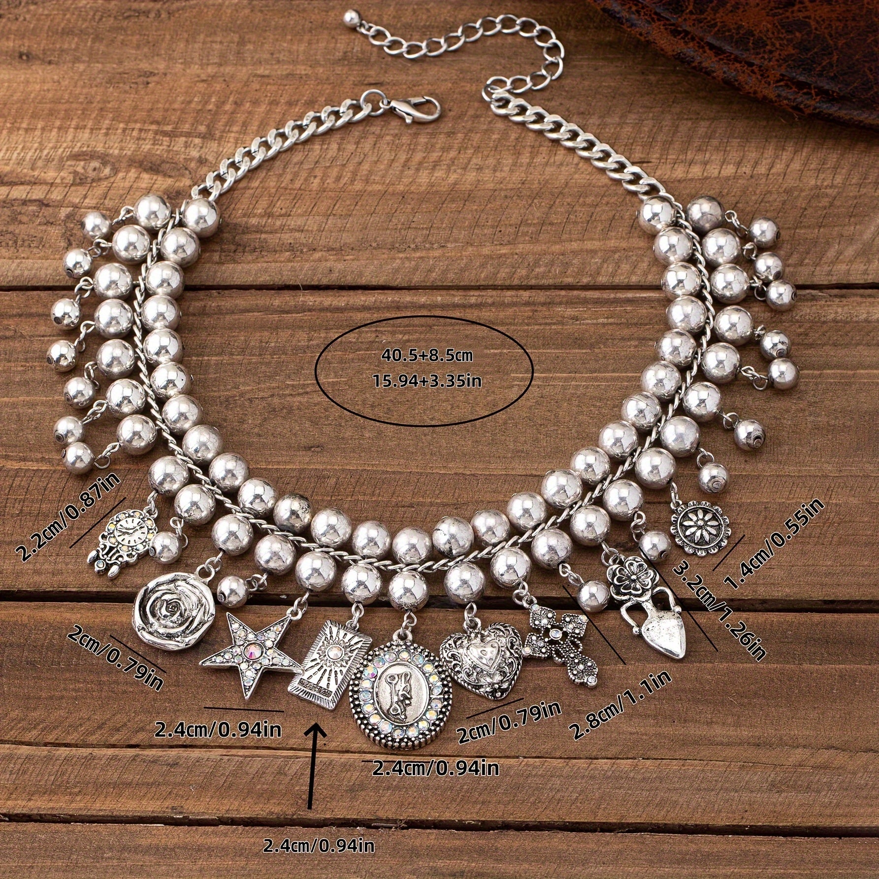 Necklace with pendants in the shape of a rose, pentagram, oval, heart and cross