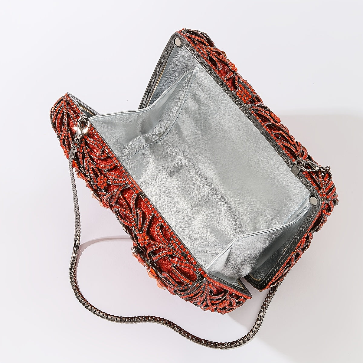 Evening clutch with glass stones and floral pattern