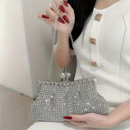Glittery evening clutch decorated with rhinestones