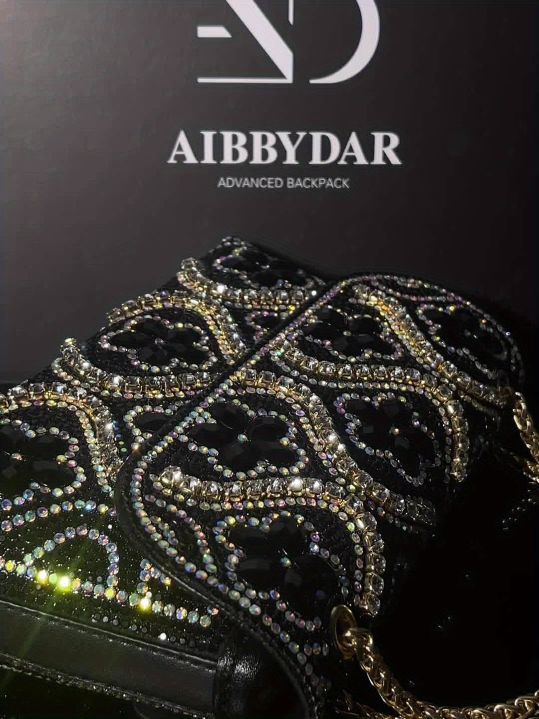 Elegant clutch with a pattern and glittering rhinestones