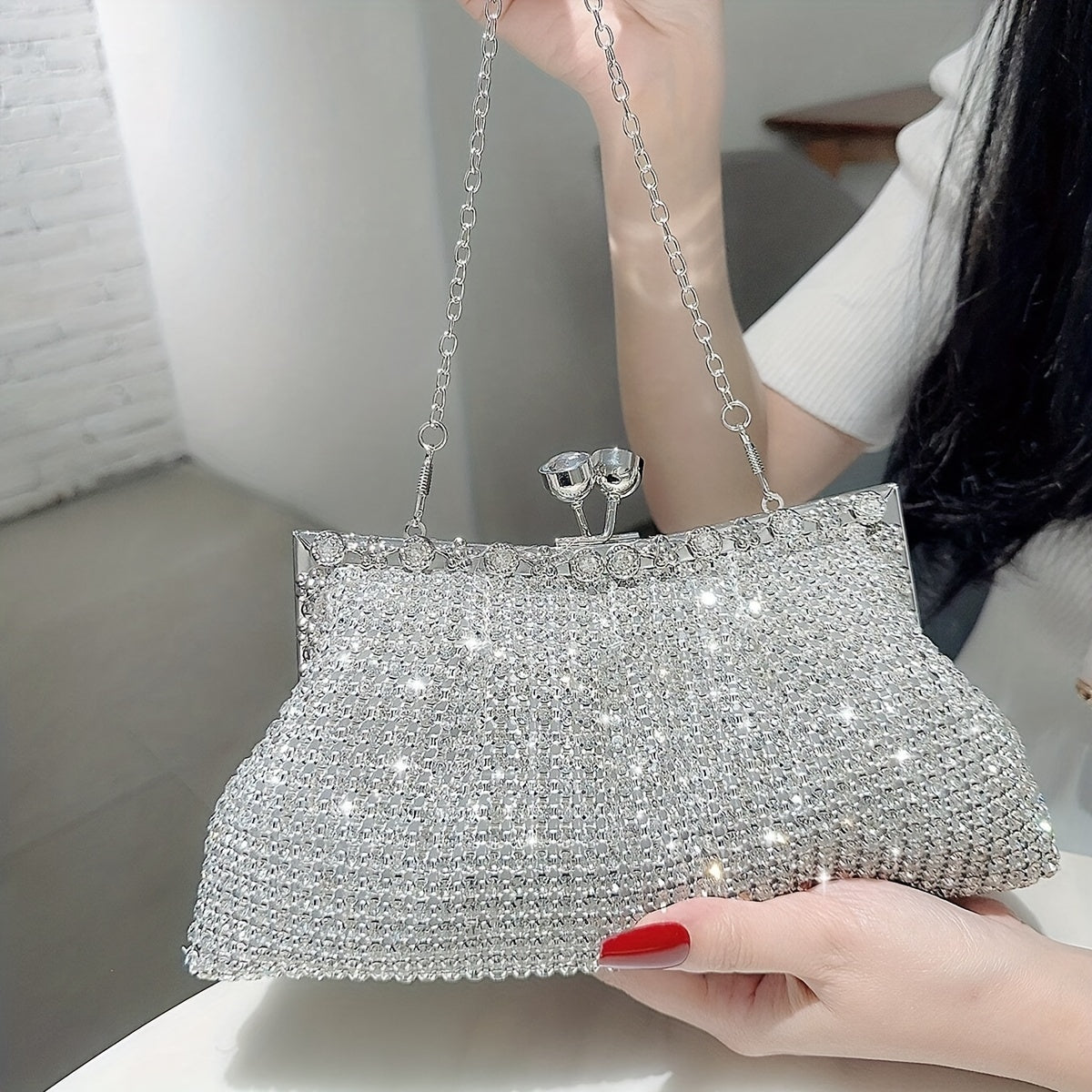 Glittery evening clutch decorated with rhinestones
