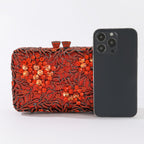 Evening clutch with glass stones and floral pattern