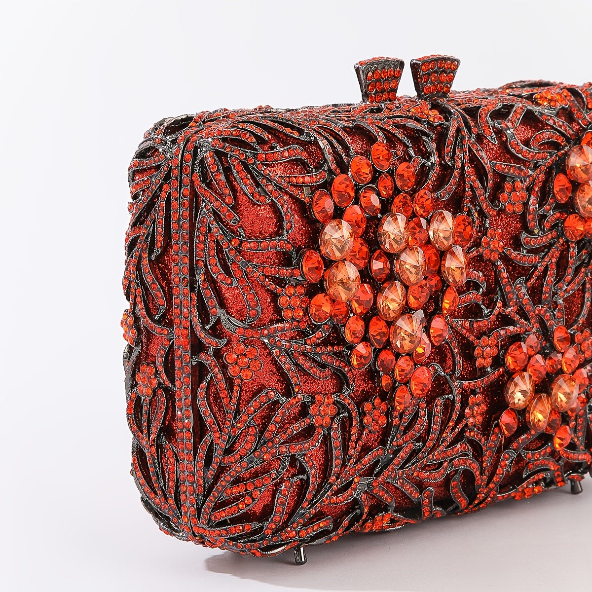 Evening clutch with glass stones and floral pattern