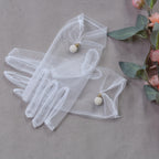 Short wedding gloves made of transparent tulle