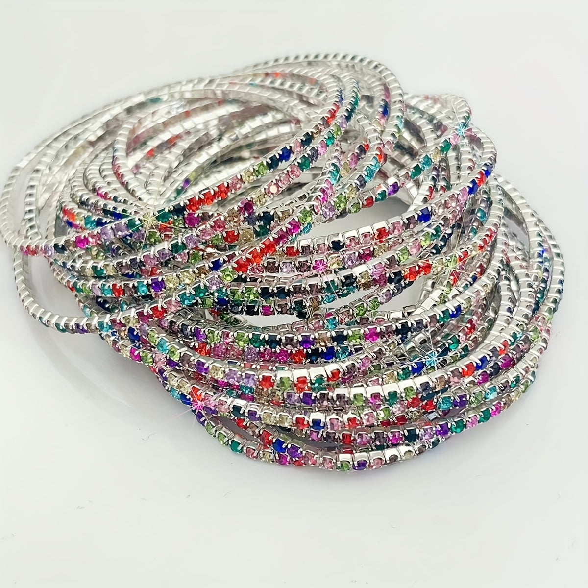 Set of 12 glittering bracelets with rhinestones