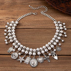 Necklace with pendants in the shape of a rose, pentagram, oval, heart and cross