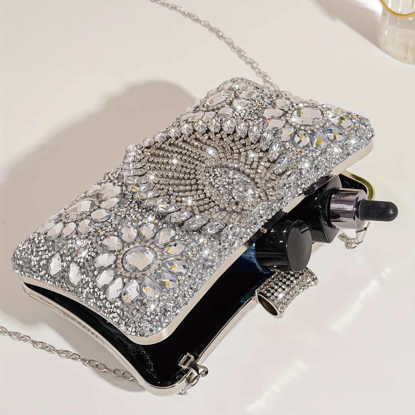 Shiny silver clutch with rhinestones