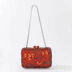 Evening clutch with glass stones and floral pattern