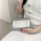 Glittery evening clutch decorated with rhinestones