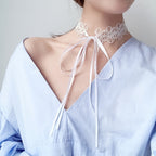 Lace necklace around the neck