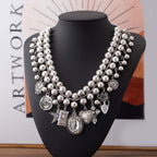 Necklace with pendants in the shape of a rose, pentagram, oval, heart and cross