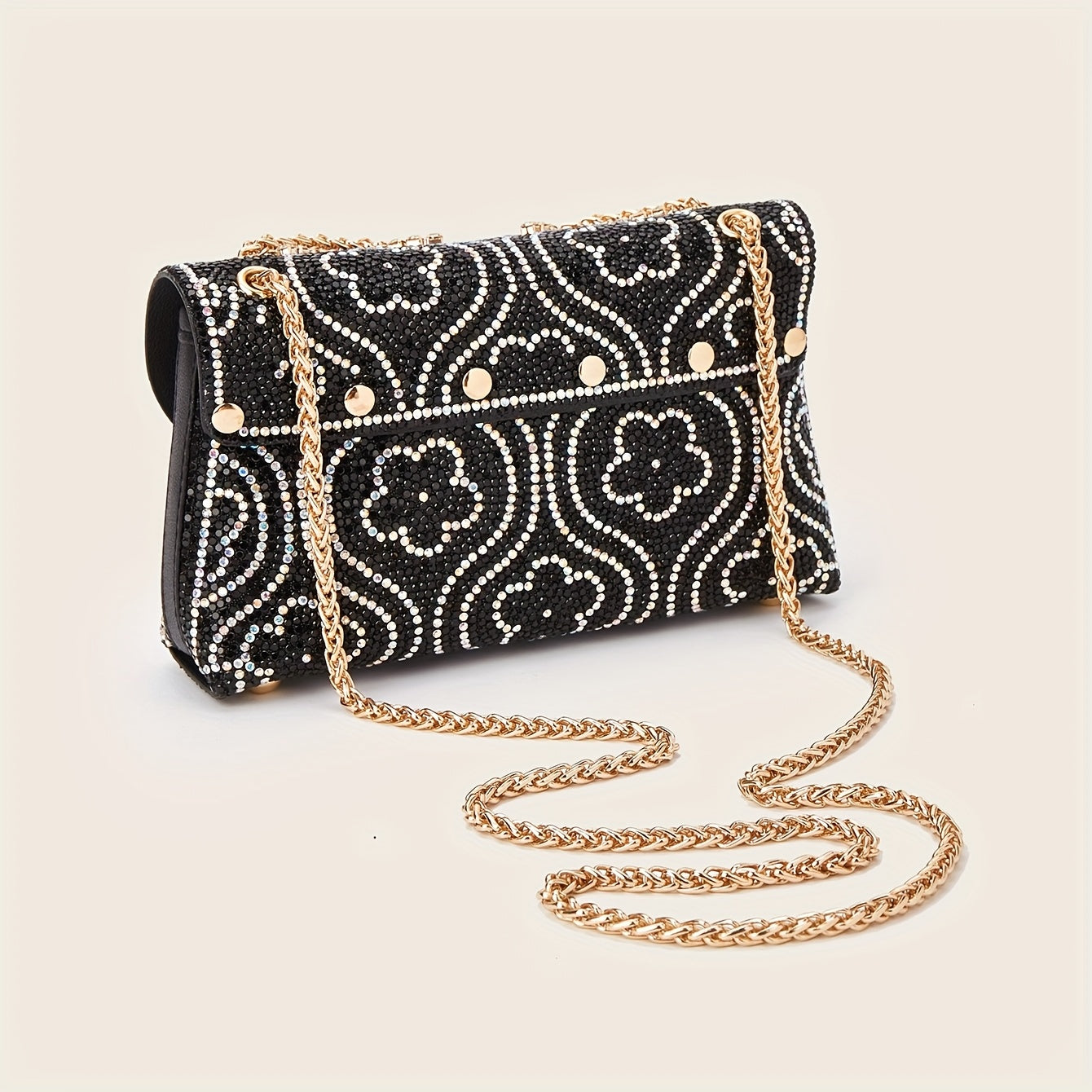 Elegant clutch with a pattern and glittering rhinestones
