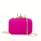Metallic lycra clutch with lotus-shaped clasp