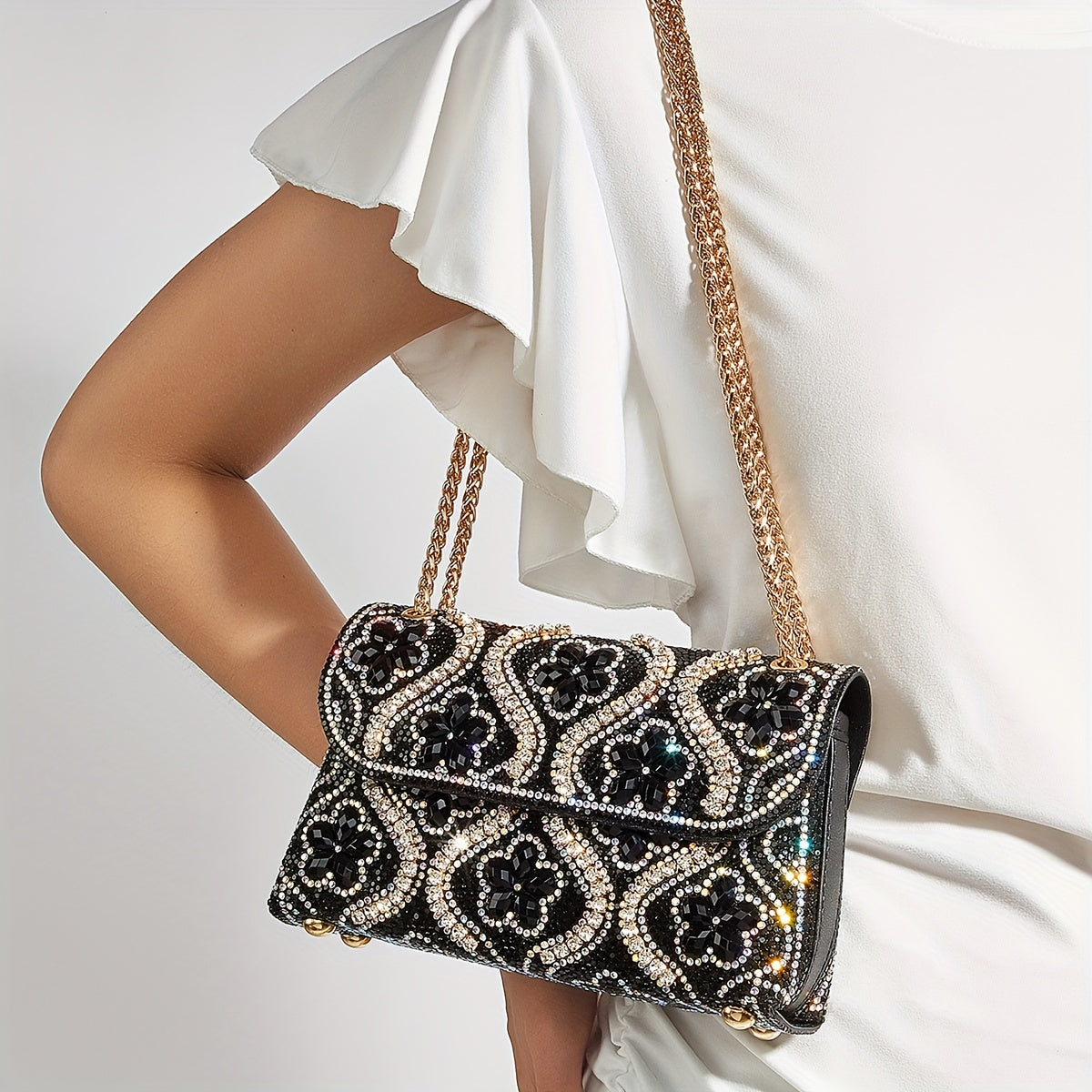 Elegant clutch with a pattern and glittering rhinestones