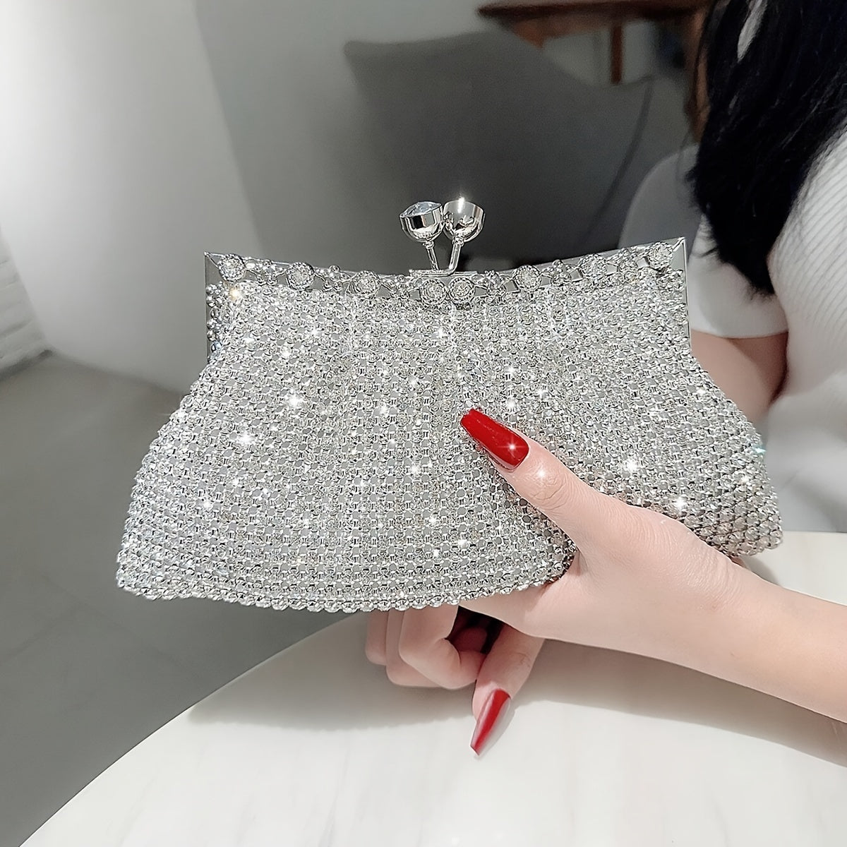 Glittery evening clutch decorated with rhinestones