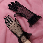 Pleated black gloves with a dotted pattern