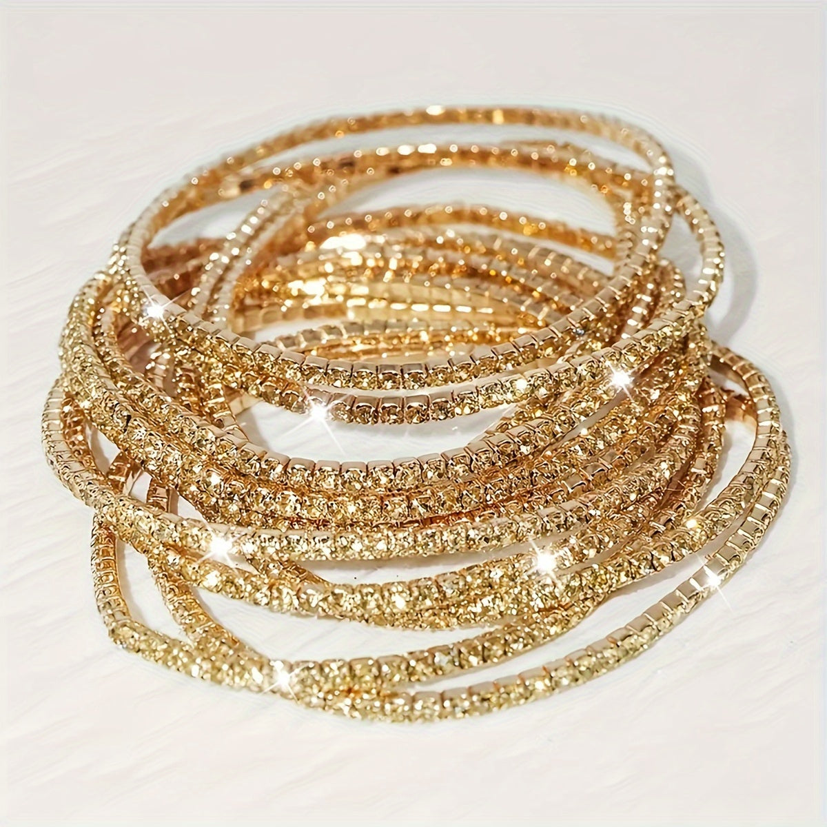 Set of 12 glittering bracelets with rhinestones
