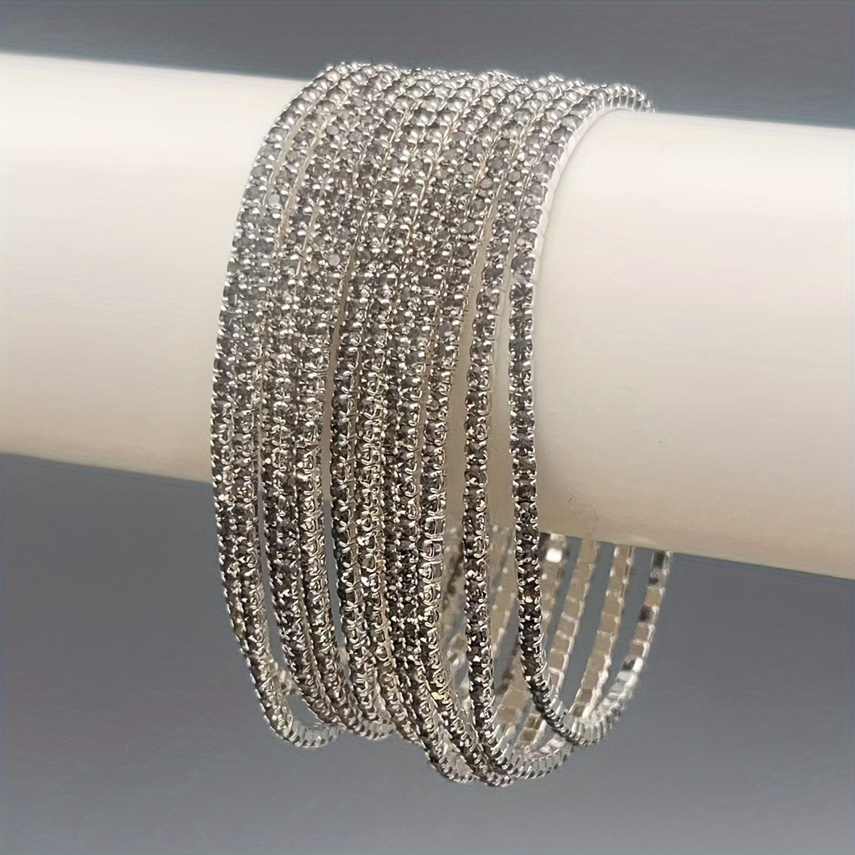Set of 12 glittering bracelets with rhinestones