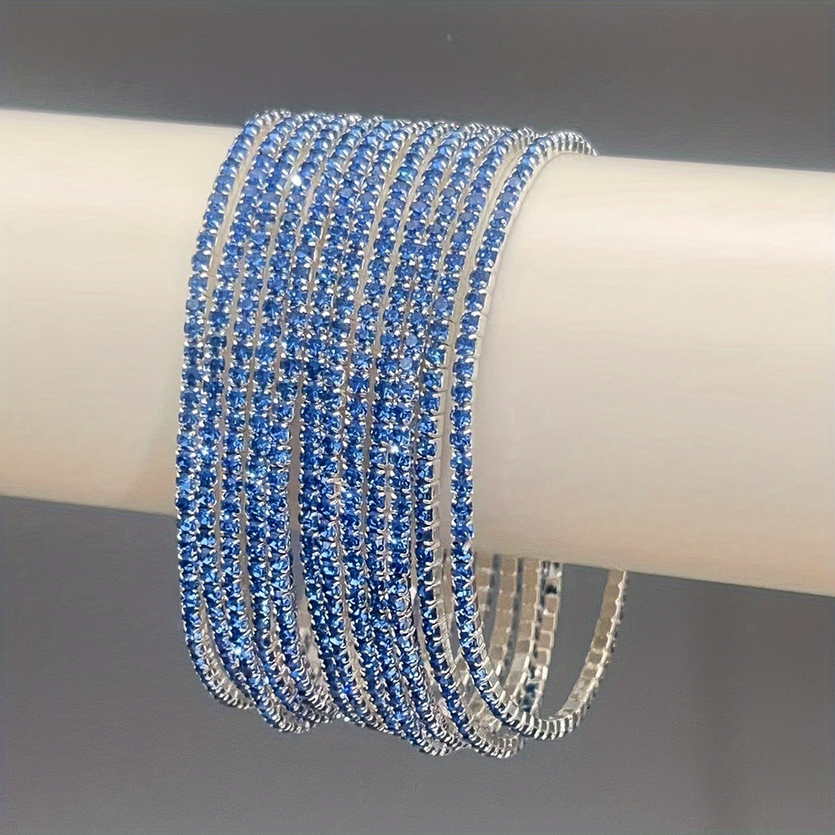 Set of 12 glittering bracelets with rhinestones