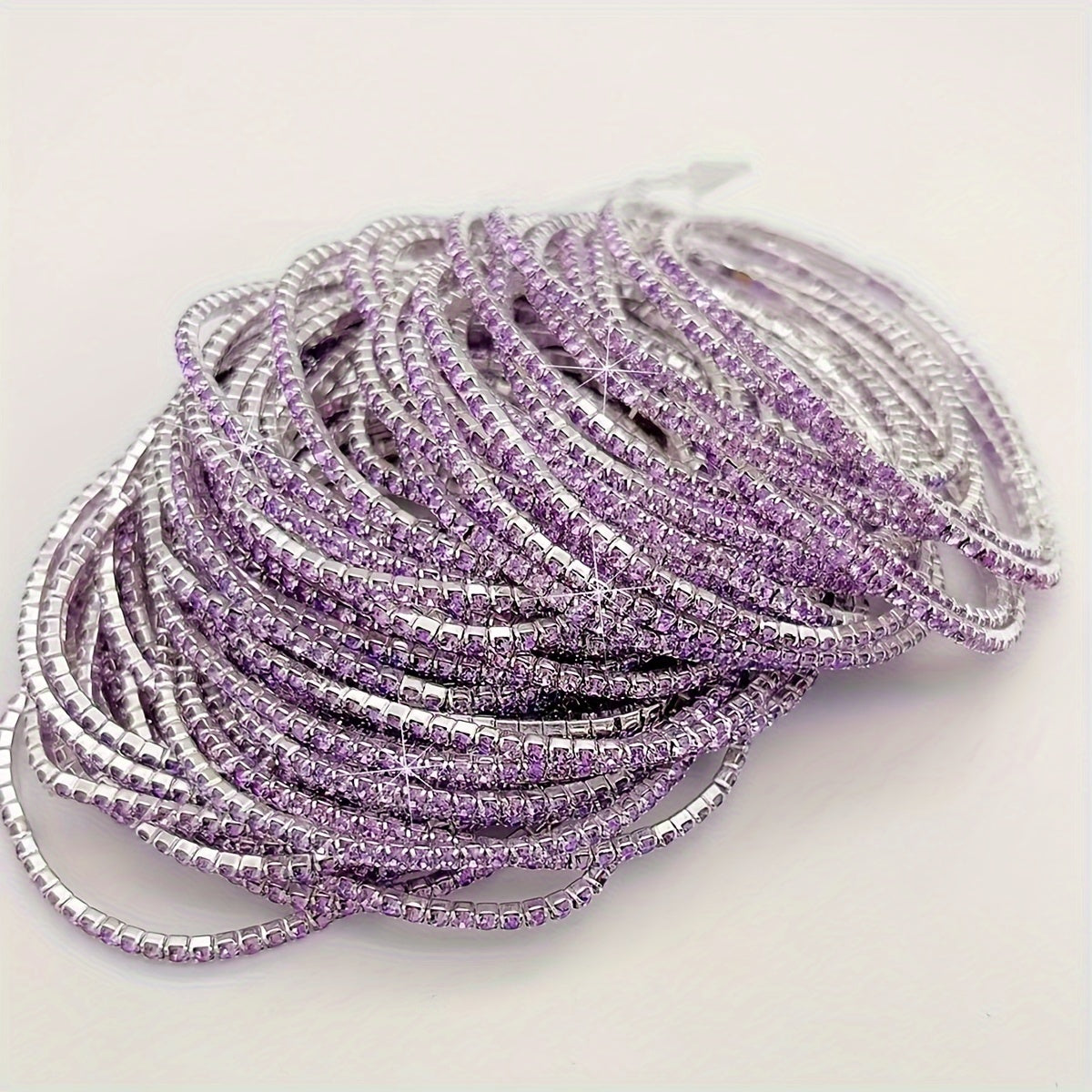 Set of 12 glittering bracelets with rhinestones