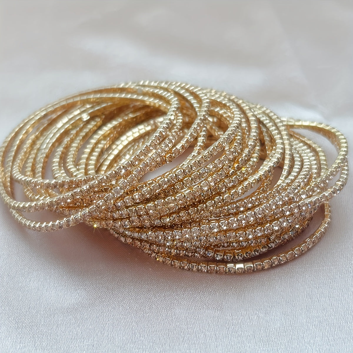Set of 12 glittering bracelets with rhinestones