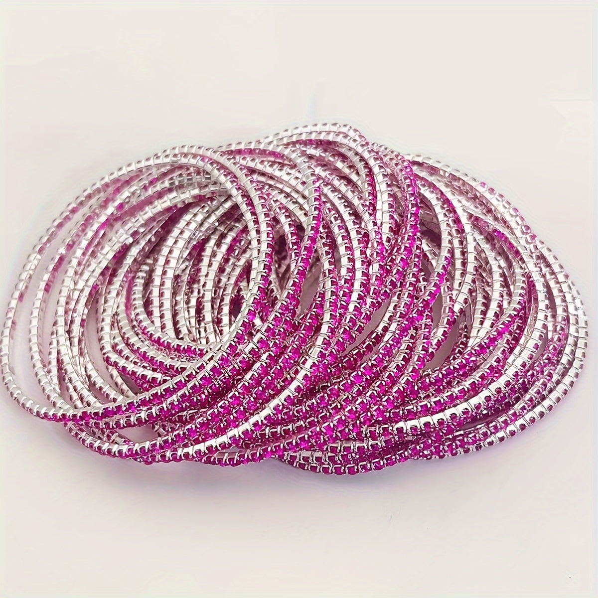 Set of 12 glittering bracelets with rhinestones