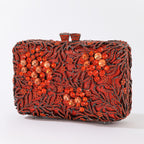 Evening clutch with glass stones and floral pattern