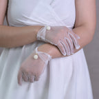 Short wedding gloves made of transparent tulle