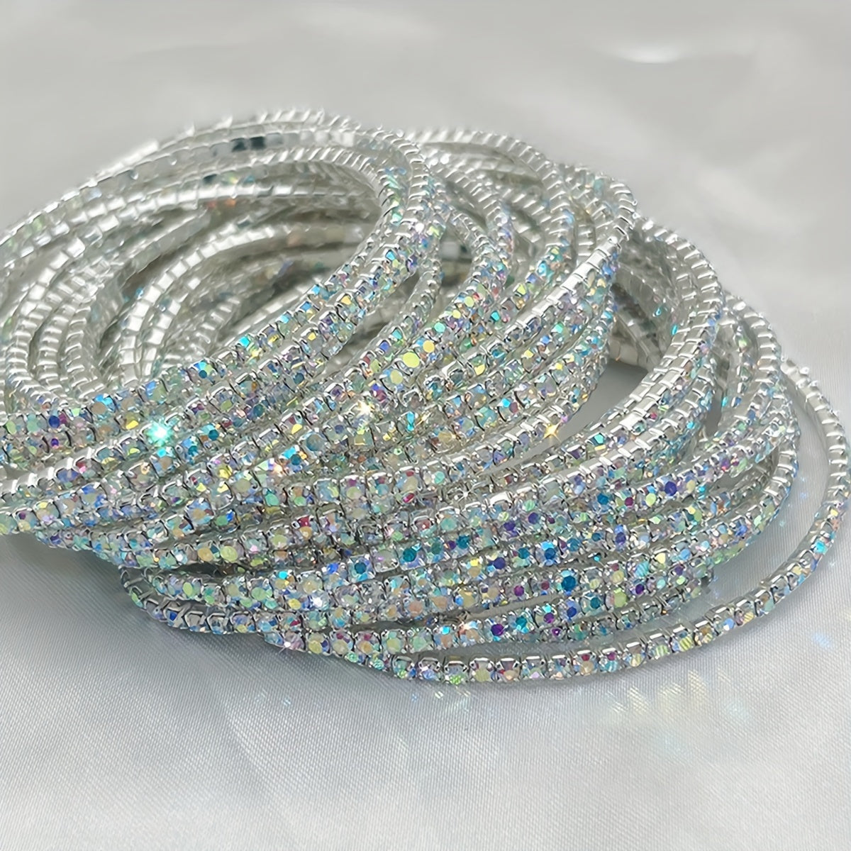 Set of 12 glittering bracelets with rhinestones