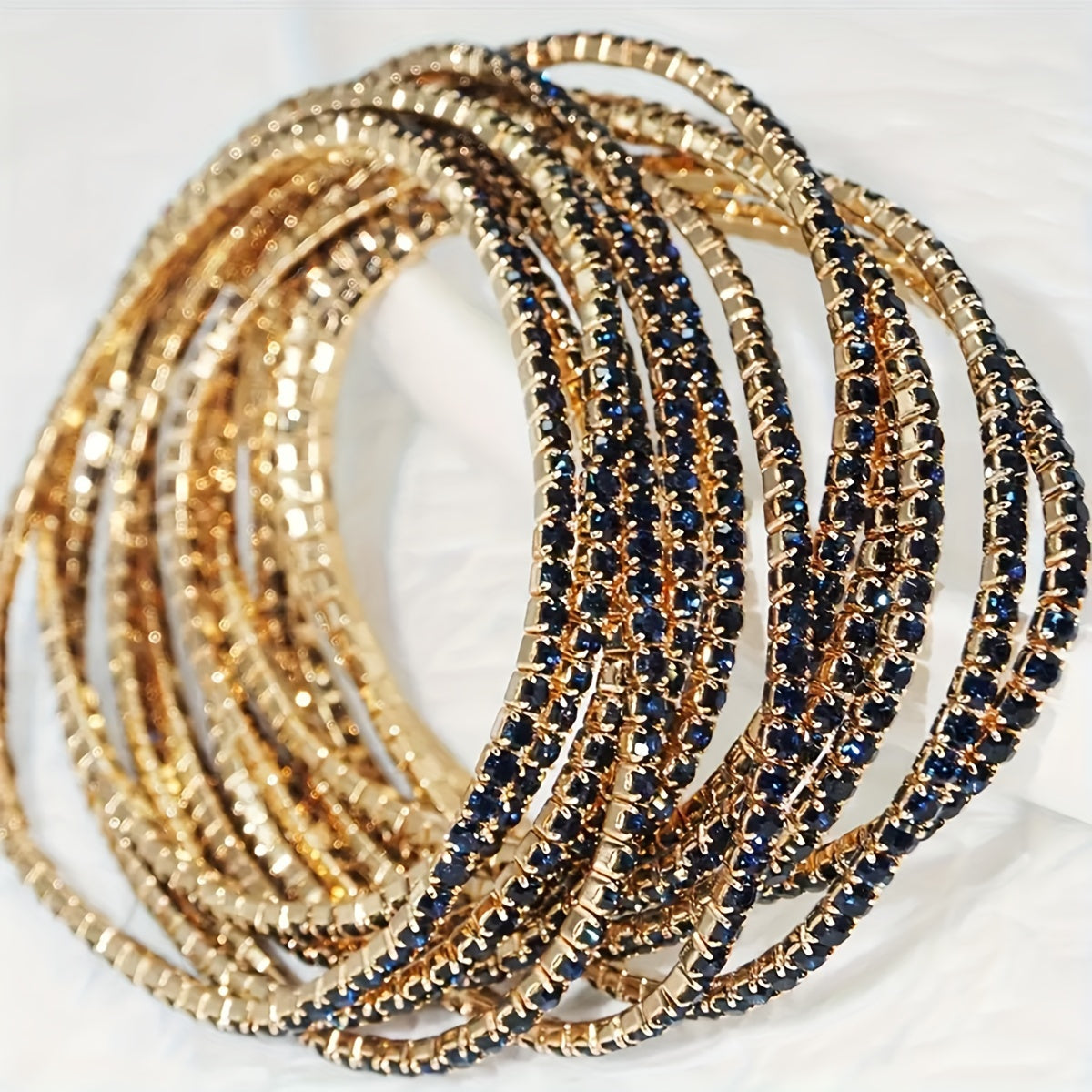 Set of 12 glittering bracelets with rhinestones