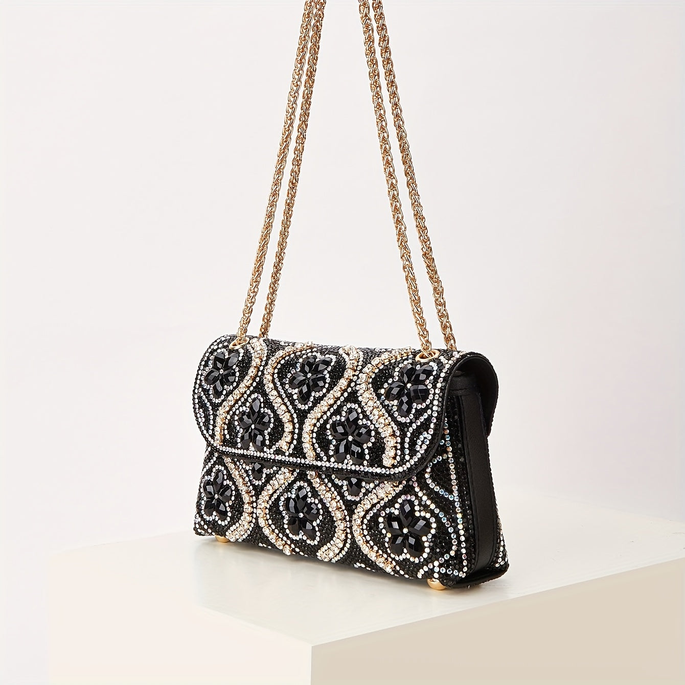 Elegant clutch with a pattern and glittering rhinestones