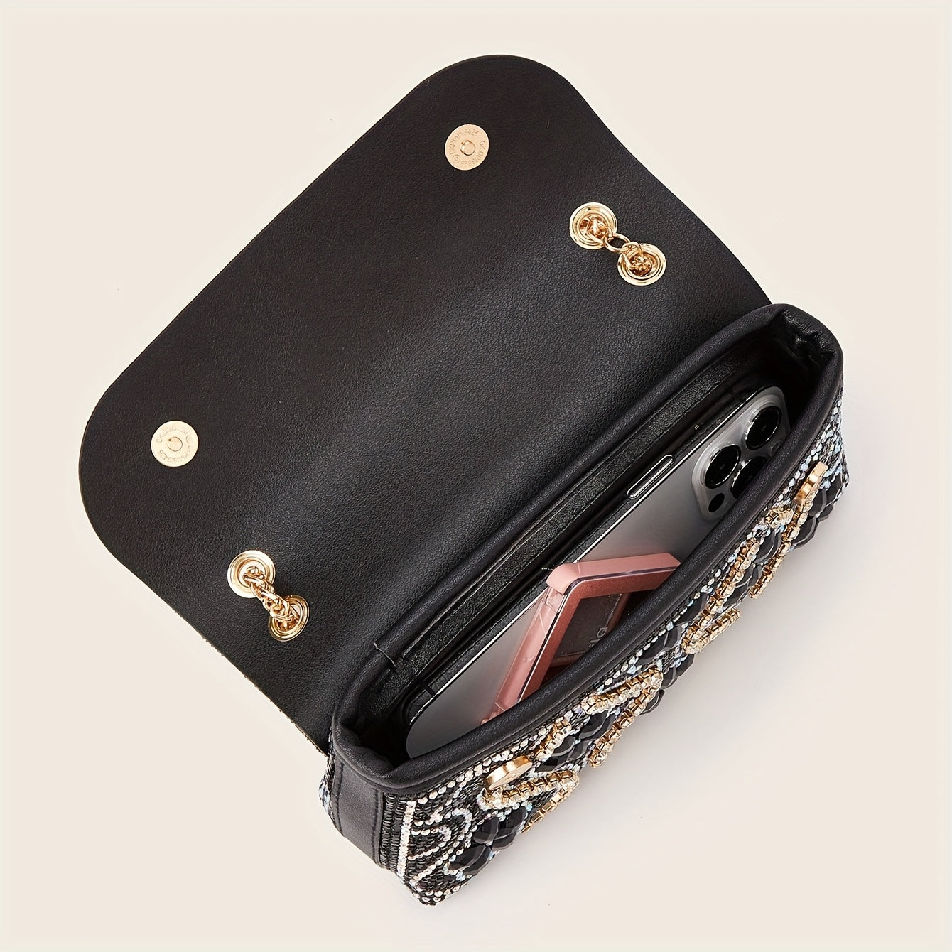 Elegant clutch with a pattern and glittering rhinestones