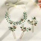 Set of handmade headband and hair clips with green rhinestones