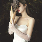 Transparent wedding gloves with hand-set pearls