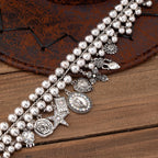 Necklace with pendants in the shape of a rose, pentagram, oval, heart and cross