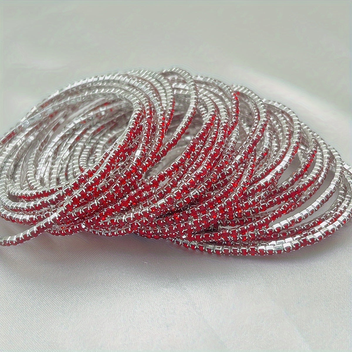 Set of 12 glittering bracelets with rhinestones
