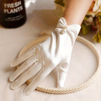 Elegant satin gloves decorated with pearls