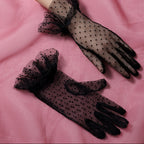 Pleated black gloves with a dotted pattern