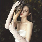 Transparent wedding gloves with hand-set pearls