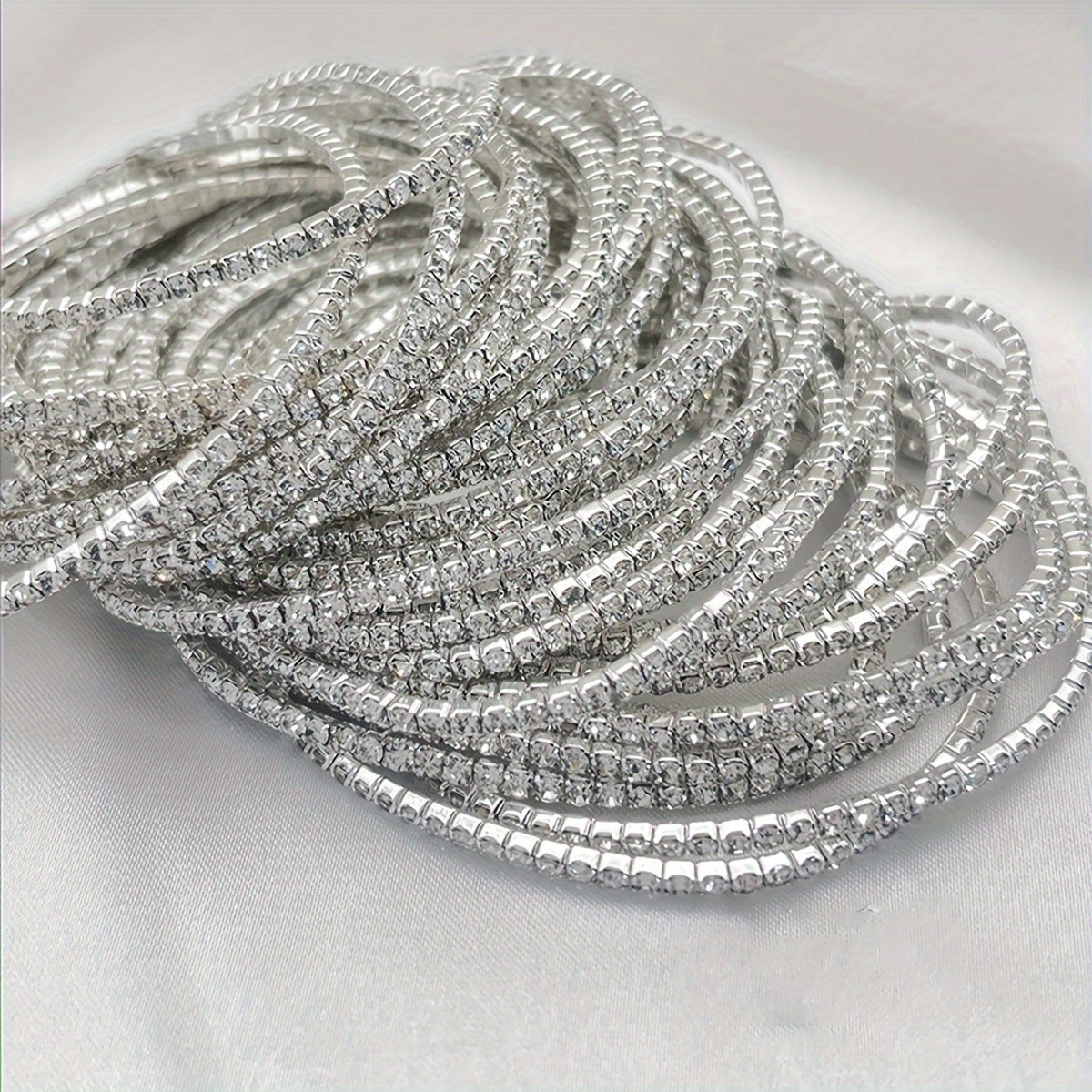 Set of 12 glittering bracelets with rhinestones