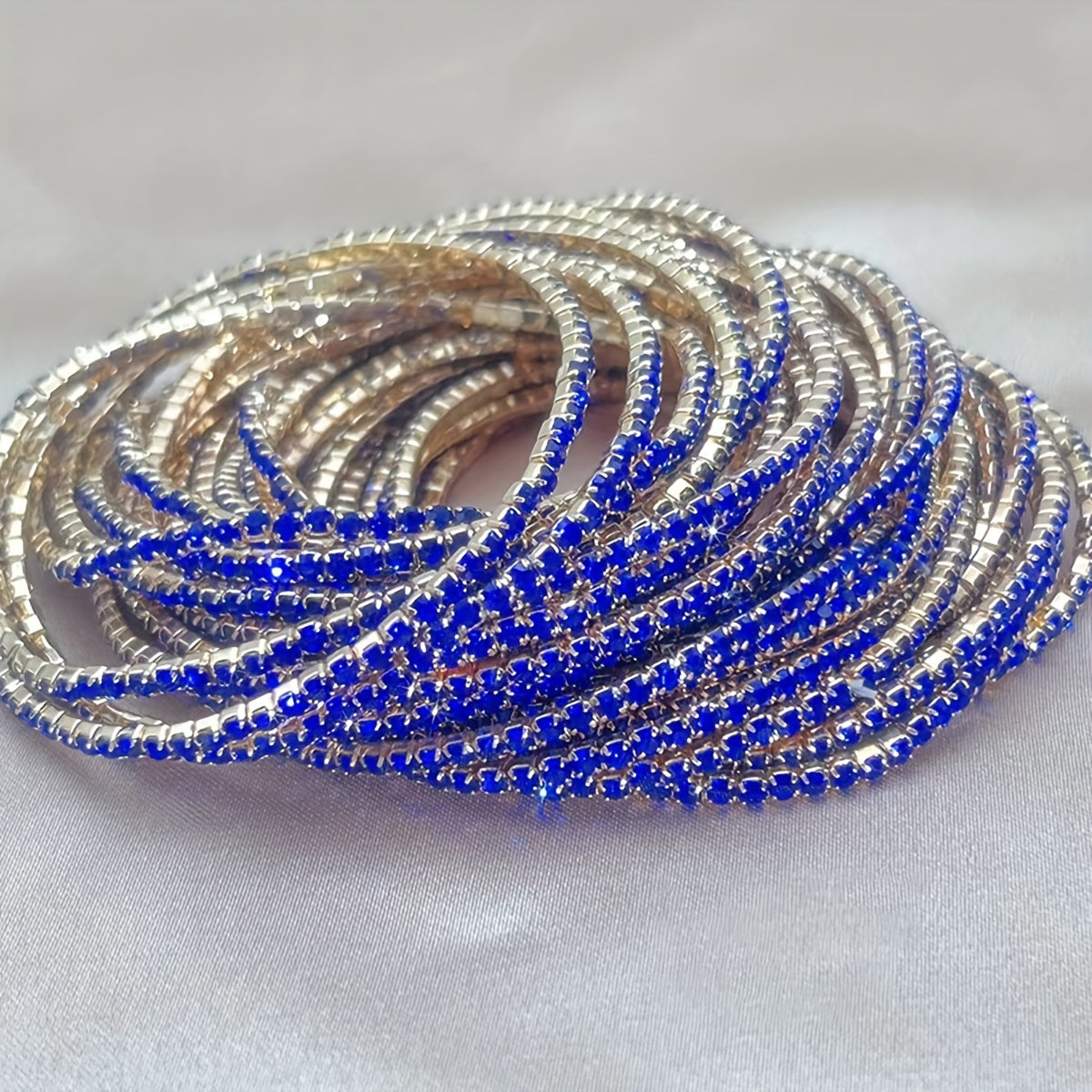 Set of 12 glittering bracelets with rhinestones